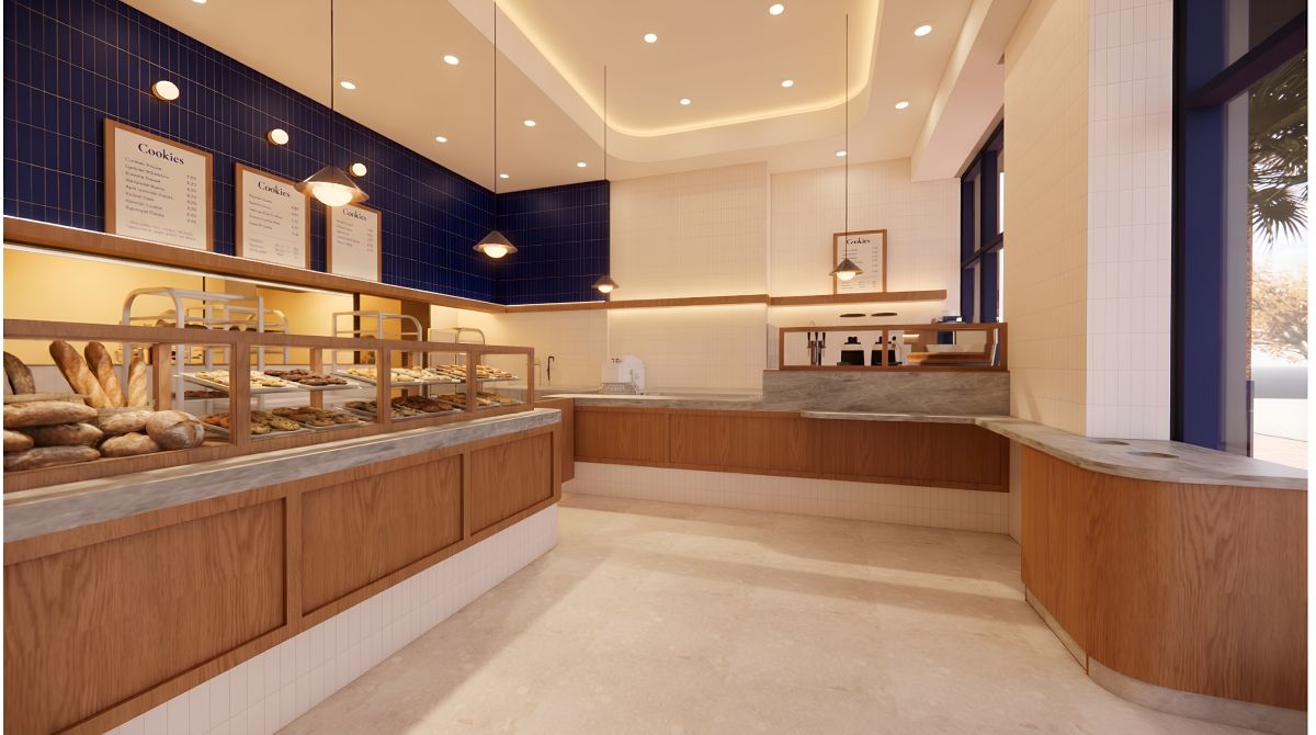 Levain Bakery pastry display with wood shelving, fresh baked goods, blue tile walls, and ambient lighting